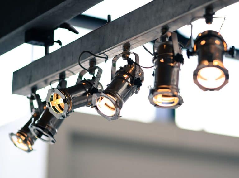 Adjustable track lighting fixtures on a ceiling rail