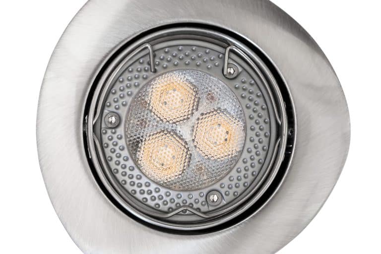Close-up of a recessed LED light fixture with a metal trim ring