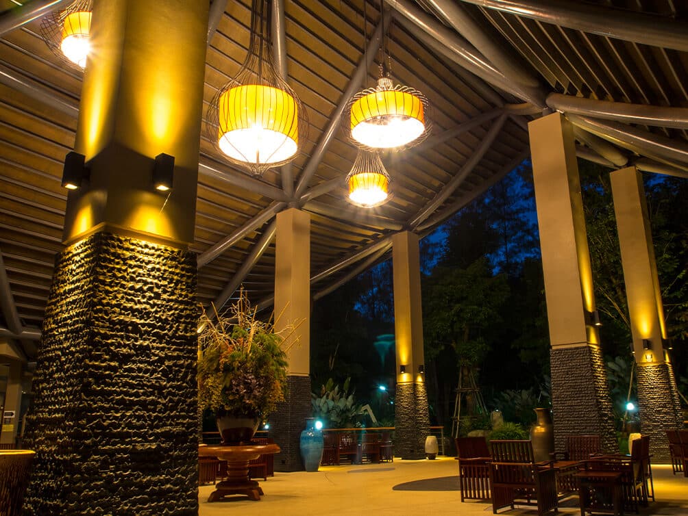 Outdoor pavilion with warm pendant and column lighting